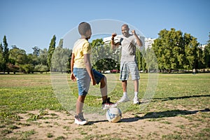 Portrait of smiling dad and his son playing ball