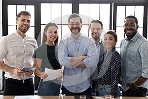 Portrait of smiling diverse businesspeople posing together in office