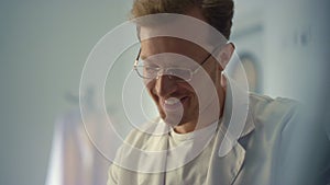 Portrait smiling doctor consulting in hospital office. Physician talking patient