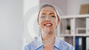 Portrait of smiling doctor or nurse at hospital