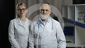 Portrait of smiling doctos in hospital office