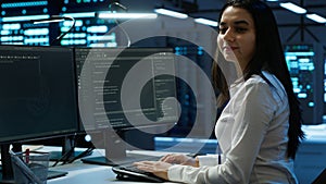 Portrait of smiling engineer overseeing data center