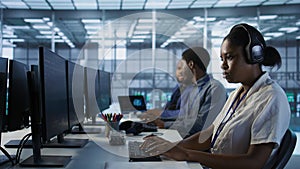Portrait of smiling engineer wearing headphones in data center photo