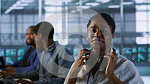 Portrait of smiling engineer wearing headphones in data center photo
