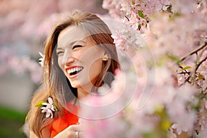 Portrait of smiling face Beautiful brunette woman in spring trees background