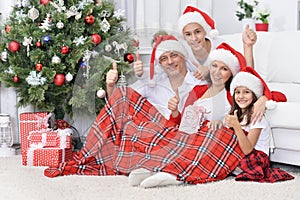 Portrait of a smiling family celebrating Christmas