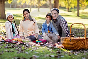 Portrait of smiling family at park