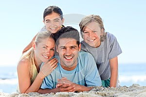 Portrait of a smiling famiy at the beach