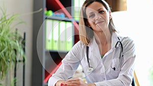 Portrait of smiling female doctor in clinic