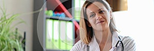 Portrait of smiling female doctor in clinic