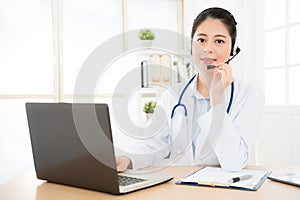 Portrait of smiling female doctor in conversation