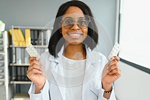 Portrait Of Smiling Female Doctor Wearing White Coat With Stethoscope In Hospital Office.