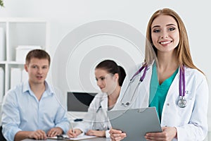 Portrait of smiling female medicine doctor at work