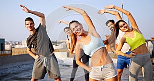 Portrait of smiling fit happy people doing power fitness exercise