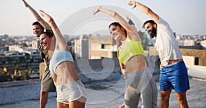 Portrait of smiling fit happy people doing power fitness exercise