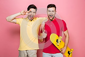 Portrait of a smiling gay male couple showing peace gesture