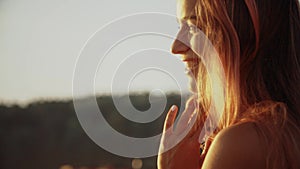 Portrait smiling girl in bikini enjoying by ocean on beach vacation