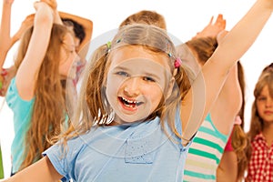 Portrait of smiling girl with friends on back