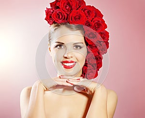 Portrait of smiling girl with red roses hairstyle