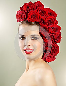 Portrait of smiling girl with red roses hairstyle