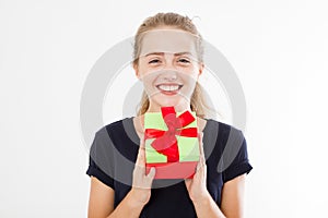 Portrait of a smiling girl, woman holding stack of gift boxes isolated on white background. Holiday concept. Mock up, template.