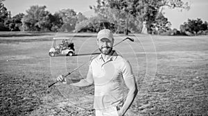 portrait of smiling golfer in cap with golf club, summer