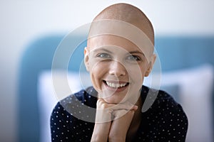 Portrait of smiling hairless woman cancer fighter