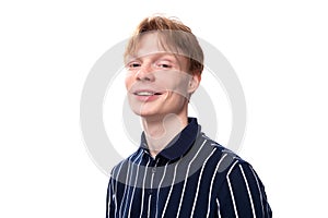 portrait of a smiling handsome european 25s blond man in a blue polo