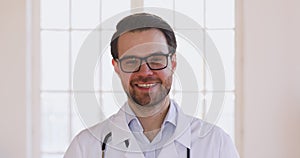 Portrait of smiling handsome medical worker pediatrician general practitioner.