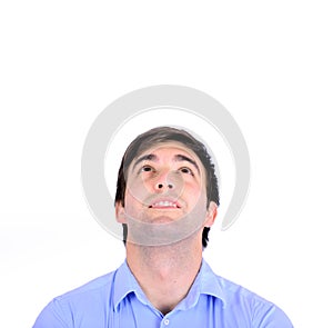 Portrait of smiling handsome young man looking above isolated o