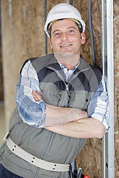 portrait smiling handyman standing in site