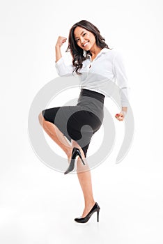 Portrait of a smiling happy asian businesswoman celebrating her success