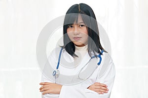 Portrait of smiling or happy asian female doctor on white background.