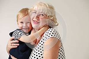 Portrait of a smiling and happy grandmother and her grandson