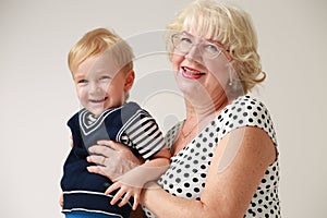 Portrait of a smiling and happy grandmother and her grandson