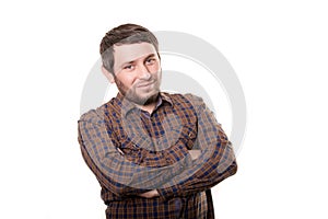 Portrait of a smiling happy handsome middle-aged man with a beard wearing a striped shirt looking at the camera with a