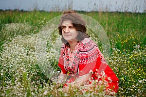 Portrait smiling happy old Elderly woman having fun, walking in a field with poppy flowers. Healthcare lifestyle senior lady relax