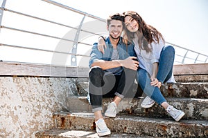 Portrait of a smiling happy young couple looking at camera