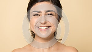 Portrait of smiling Indian woman show healthy face skin