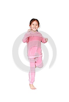 Portrait of smiling little Asian child girl in pink tracksuit or sport cloth running isolated over white background. Freedom and