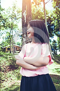 Portrait of a smiling little asian girl in the park