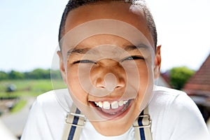 Portrait of a smiling little boy with suspenders