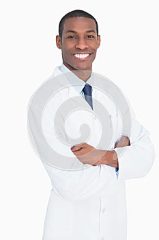 Portrait of a smiling male doctor with arms crossed