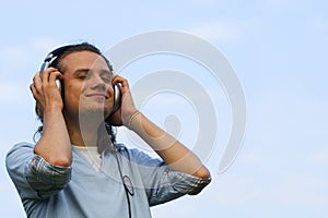 Portrait of a smiling man with earphones