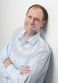 Portrait of the smiling man with glasses