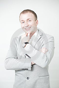 Portrait of smiling man with hands against on white background