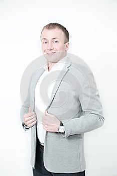 Portrait of smiling man with hands against on white background