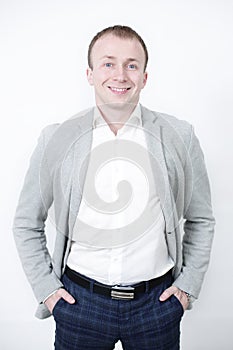 Portrait of smiling man with hands against on white background