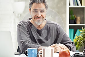 Portrait of smiling man at home,