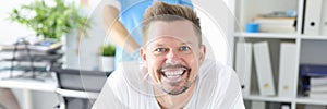 Portrait of smiling man at proctologist appointment